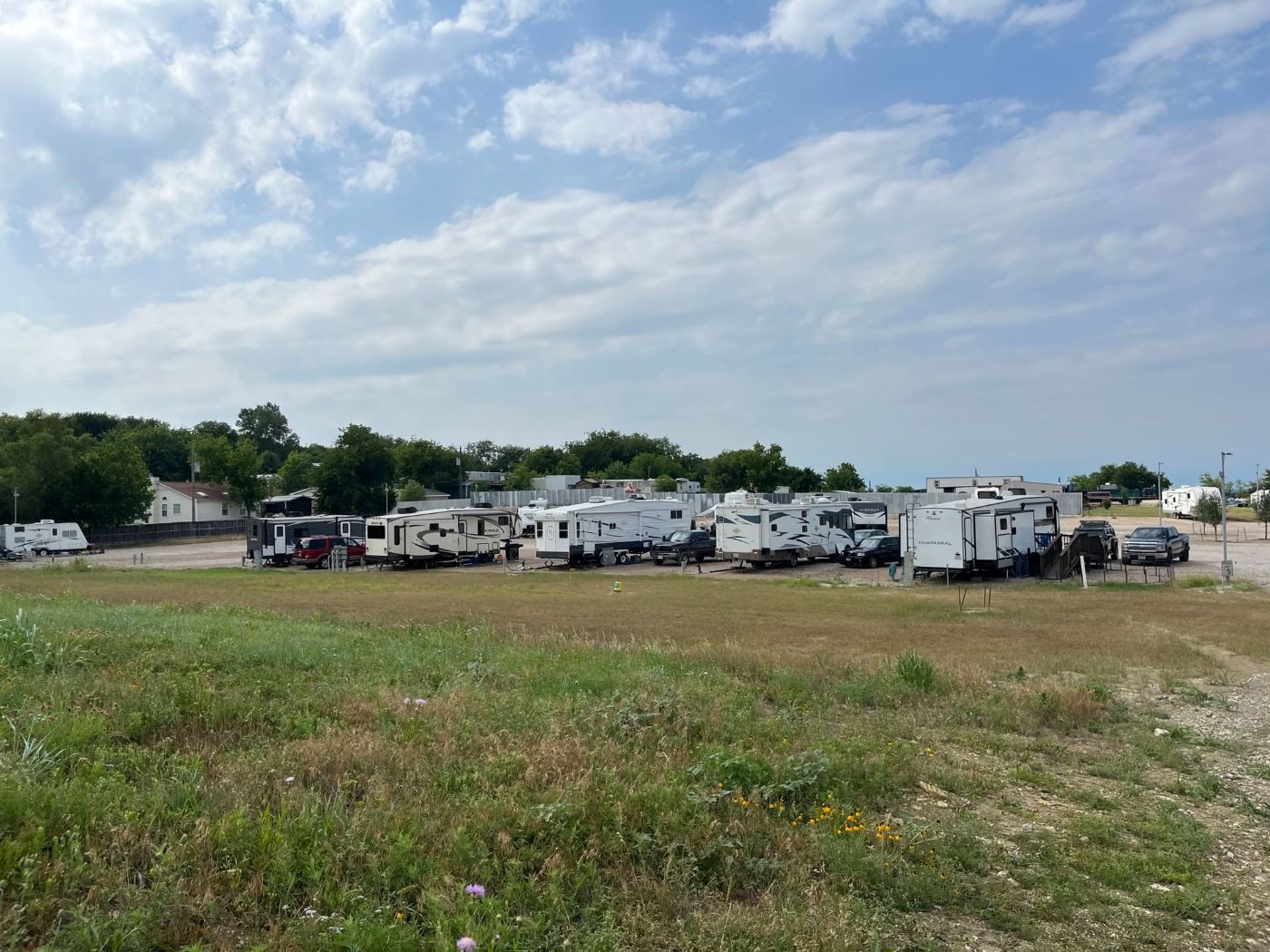 The gated entrance road into Aledo RV Community